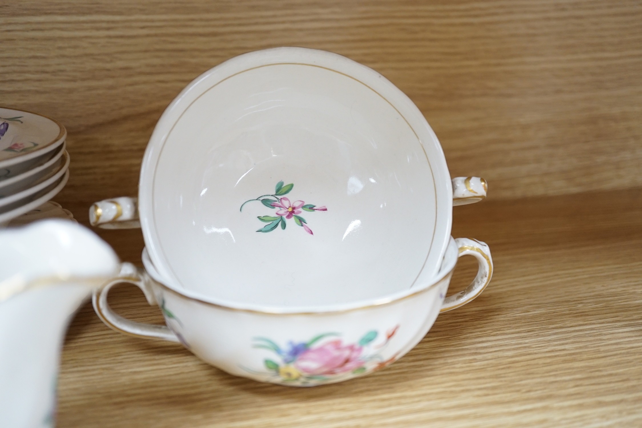 A part Clarice Cliff dinner set. With soup bowls, gravy bowl, etc. with flower decoration